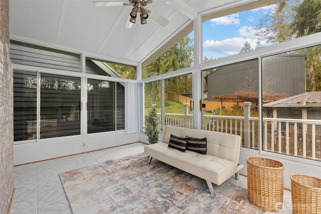 sunroom / solarium featuring lofted ceiling and a ceiling fan