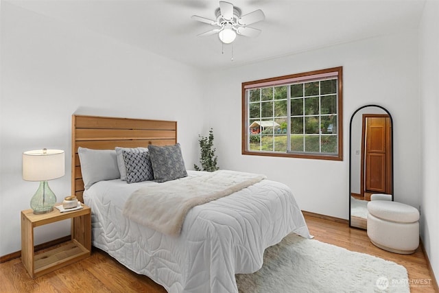 bedroom featuring light wood-style floors and a ceiling fan