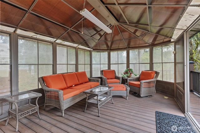 sunroom featuring lofted ceiling