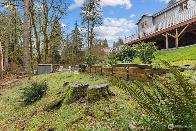 view of yard featuring a wooden deck