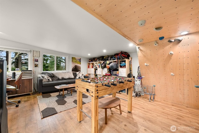 game room with lofted ceiling, recessed lighting, and light wood finished floors