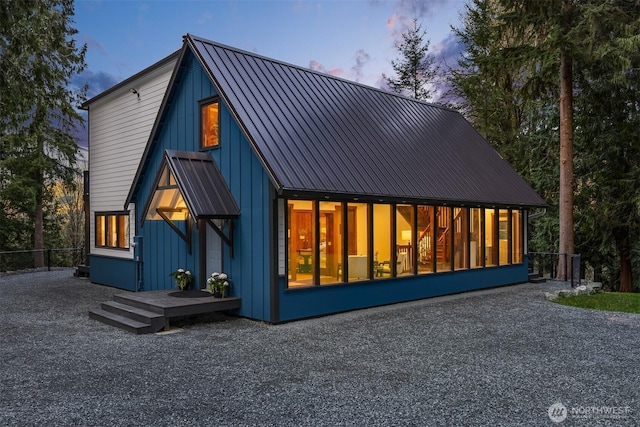 exterior space with a sunroom and fence