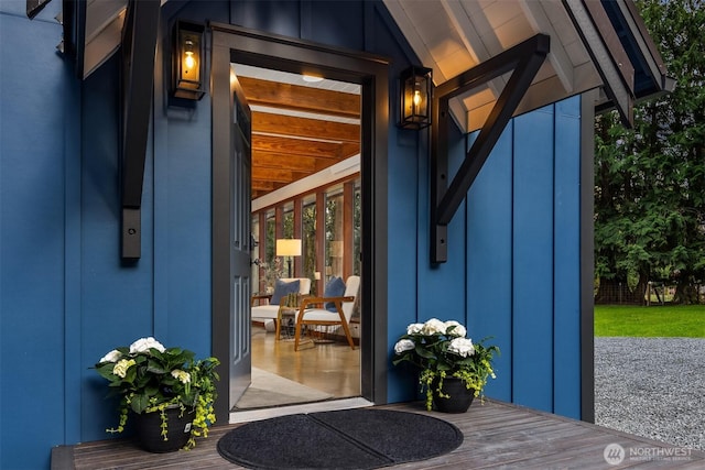 property entrance featuring board and batten siding