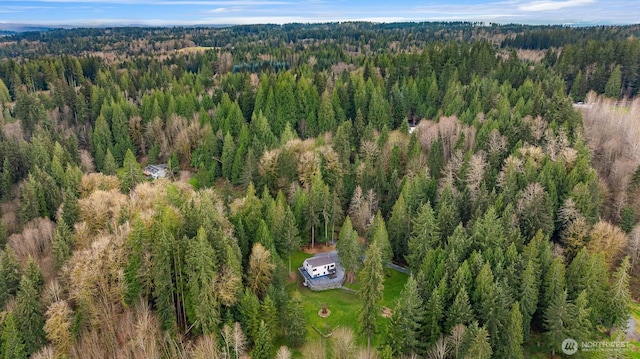 drone / aerial view featuring a forest view