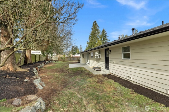 view of yard featuring a patio and a fenced backyard