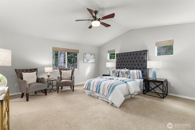 carpeted bedroom with multiple windows, baseboards, and vaulted ceiling