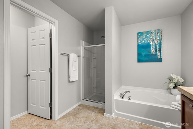 full bath featuring vanity, baseboards, tile patterned flooring, a shower stall, and a bath