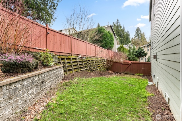 view of yard with a fenced backyard