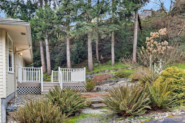 view of yard with a wooden deck