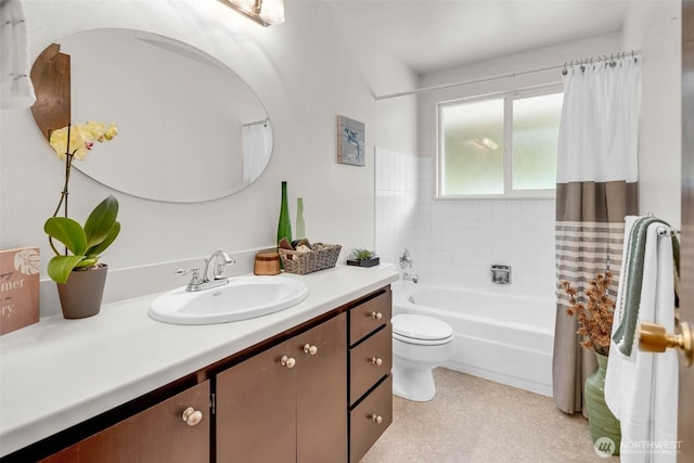 bathroom with toilet, vanity, and shower / bath combination with curtain