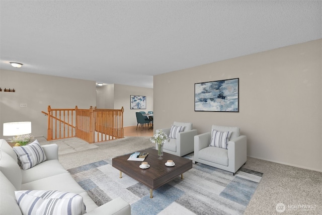 living room featuring carpet flooring and a textured ceiling