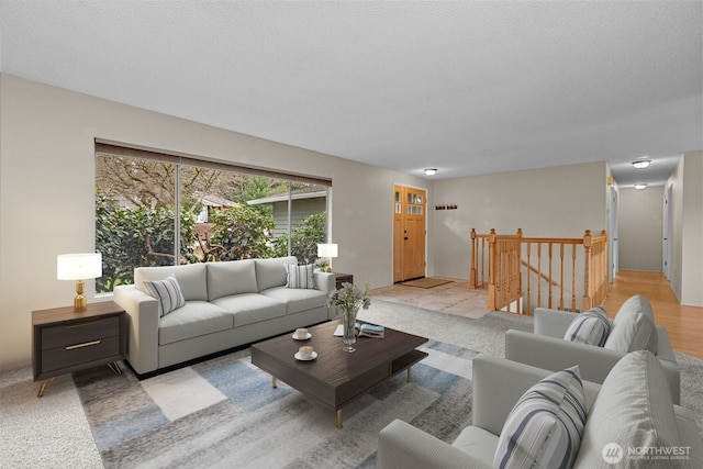 living room with a textured ceiling