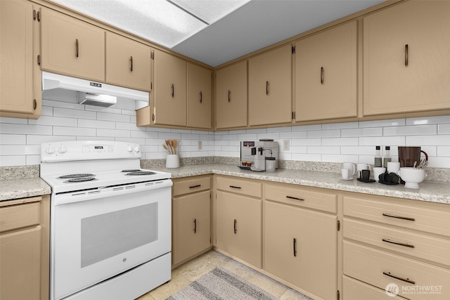 kitchen featuring under cabinet range hood, decorative backsplash, light countertops, and white range with electric cooktop