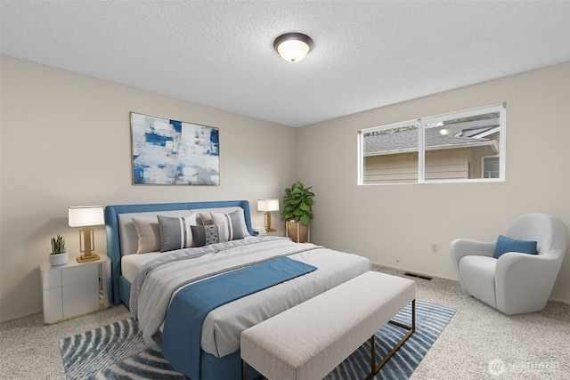 bedroom featuring carpet flooring, visible vents, and a textured ceiling