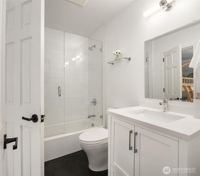 bathroom with tile patterned floors, toilet, tub / shower combination, and vanity