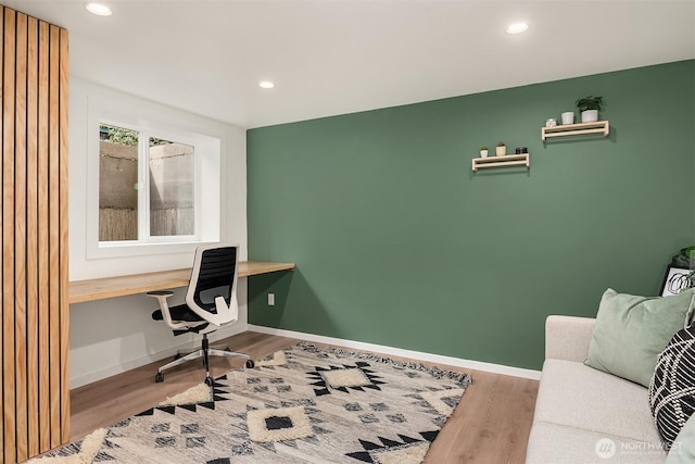 office space with recessed lighting, wood finished floors, and baseboards