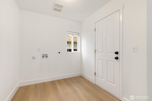 washroom featuring electric dryer hookup, light wood-type flooring, visible vents, hookup for a washing machine, and laundry area