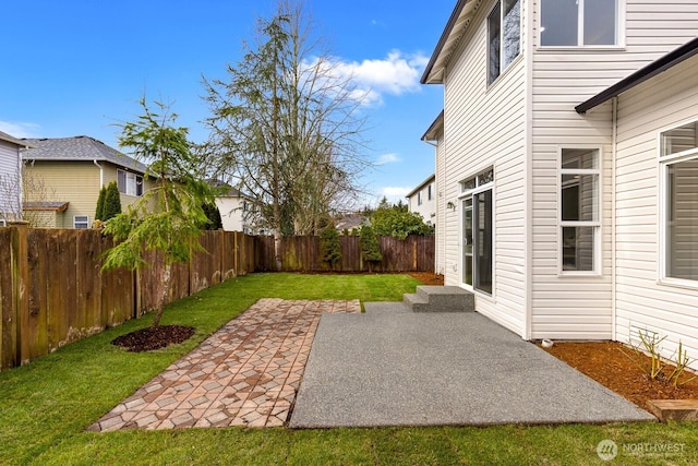 view of yard with a fenced backyard and a patio