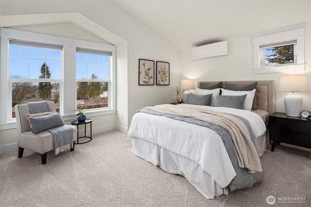 bedroom with baseboards, lofted ceiling, an AC wall unit, and carpet flooring