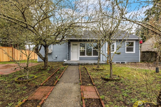 view of front of house featuring fence