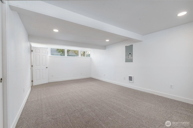 carpeted spare room featuring visible vents, recessed lighting, and baseboards