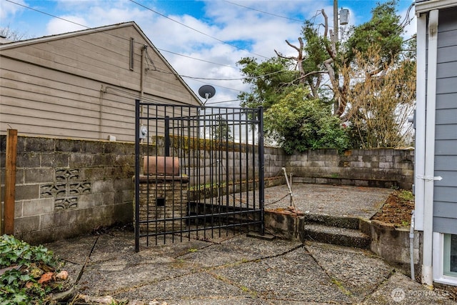 exterior space with fence and a gate