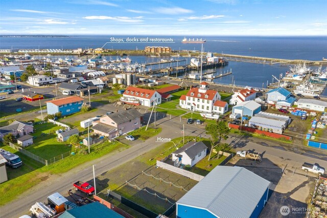 birds eye view of property featuring a water view