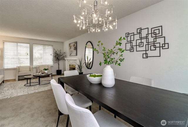 dining room with a textured ceiling and carpet