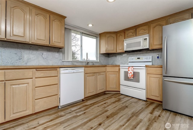 kitchen featuring light wood-type flooring, light brown cabinetry, backsplash, white appliances, and light countertops