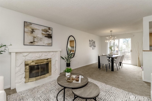 carpeted living area featuring a chandelier, baseboards, a high end fireplace, and a textured ceiling