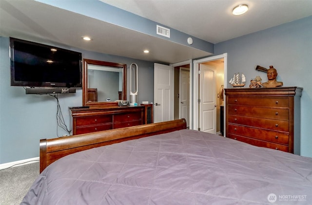 carpeted bedroom with visible vents and recessed lighting