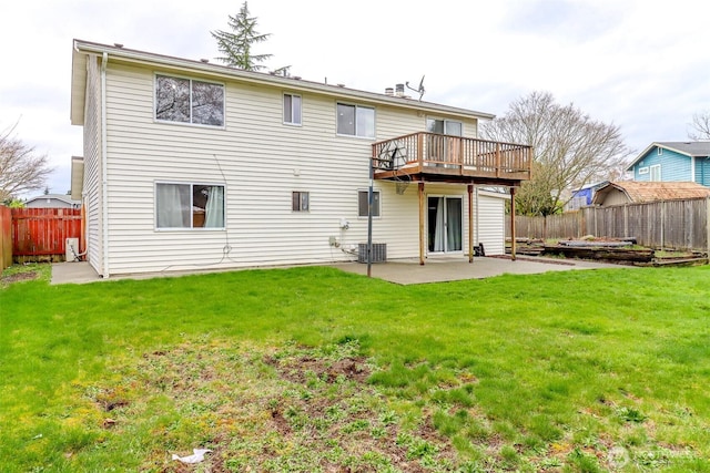 rear view of house featuring a patio, a yard, and fence