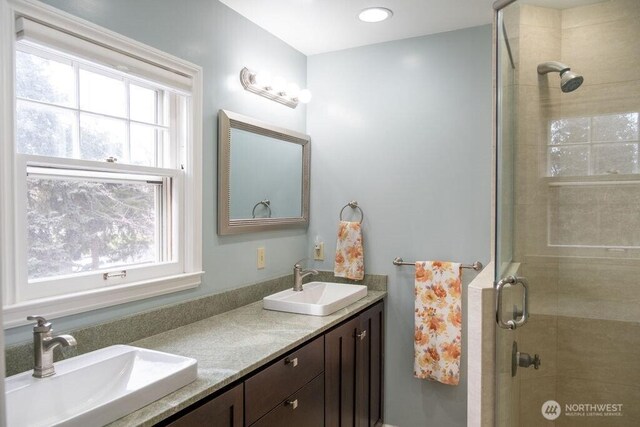 1120 Home Ave, Walla Walla, WA 99362 - full bath featuring healthy amount of natural light, tiled shower, and double vanity