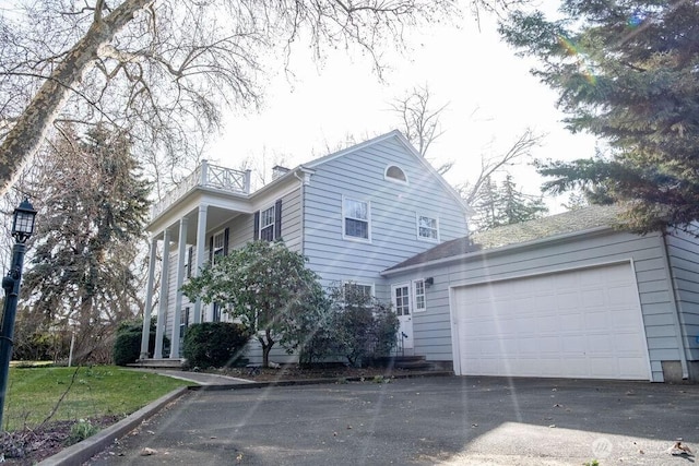 1120 Home Ave, Walla Walla, WA 99362 - view of side of property with a balcony, driveway, and a garage