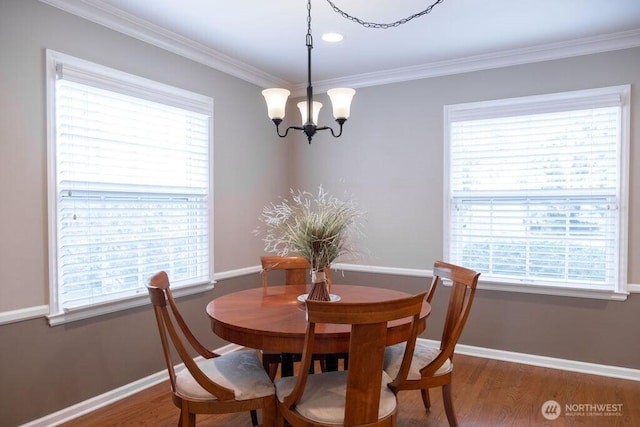 1120 Home Ave, Walla Walla, WA 99362 - dining area featuring a chandelier, plenty of natural light, wood finished floors, and crown molding