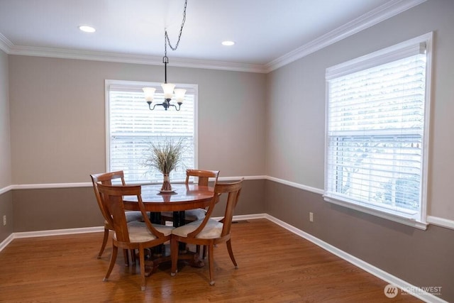 1120 Home Ave, Walla Walla, WA 99362 - dining room featuring a chandelier, healthy amount of natural light, wood finished floors, crown molding, and recessed lighting