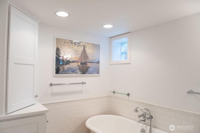 1120 Home Ave, Walla Walla, WA 99362 - bathroom with a freestanding bath, wainscoting, tile walls, and recessed lighting