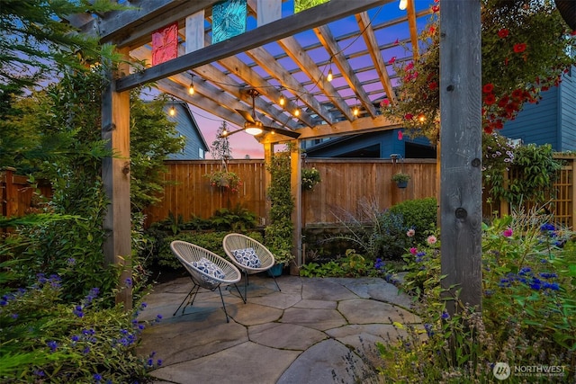 view of patio / terrace featuring a fenced backyard and a pergola