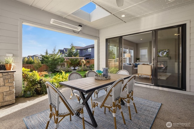 view of patio / terrace featuring outdoor dining area and fence