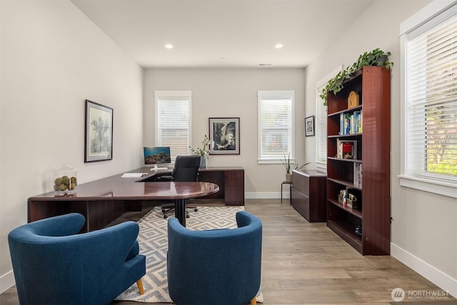 office featuring recessed lighting, baseboards, and light wood-style floors