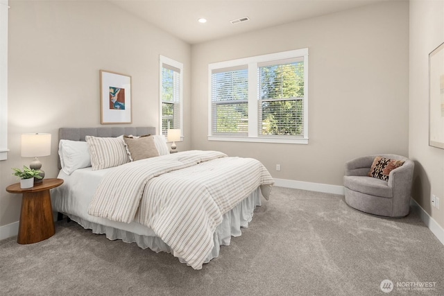 carpeted bedroom with visible vents, recessed lighting, and baseboards