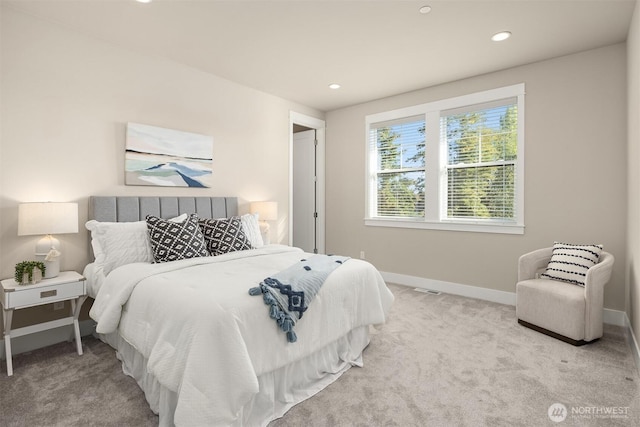 carpeted bedroom featuring recessed lighting and baseboards