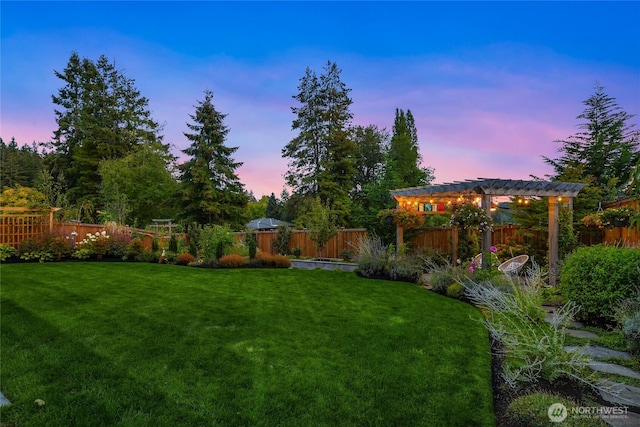 view of yard with a fenced backyard and a pergola