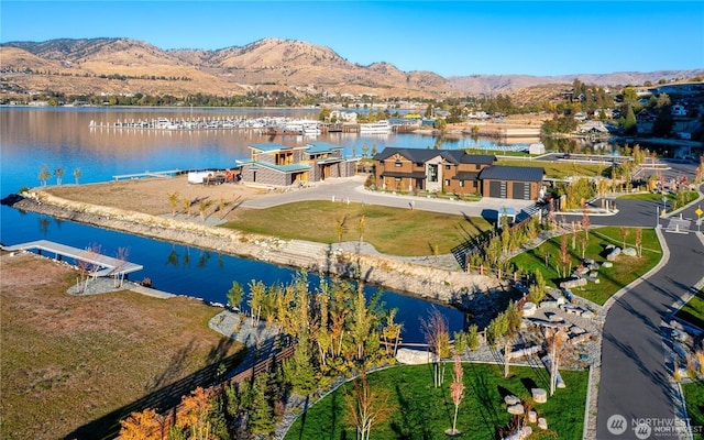 birds eye view of property featuring a water and mountain view