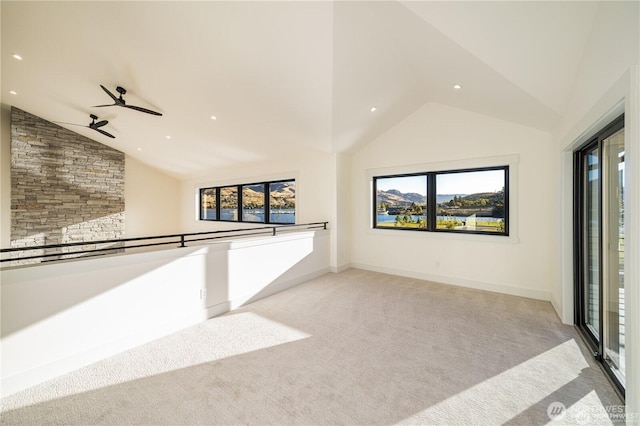 carpeted spare room featuring recessed lighting, a ceiling fan, baseboards, and high vaulted ceiling