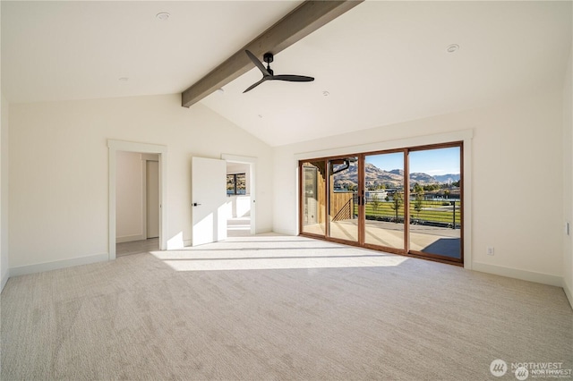 spare room with lofted ceiling with beams, baseboards, carpet, and ceiling fan