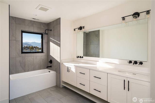 bathroom featuring a sink, shower / bath combination, visible vents, and double vanity