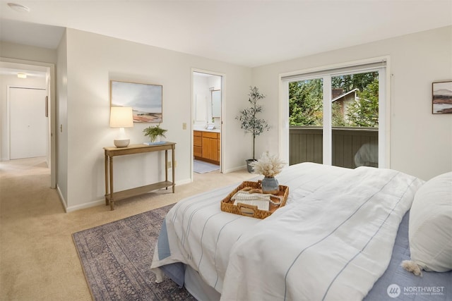 bedroom with ensuite bath, access to outside, light colored carpet, and baseboards