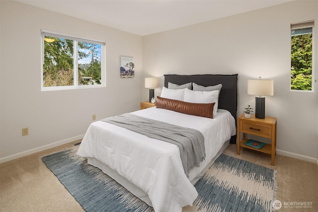 bedroom with carpet flooring and baseboards