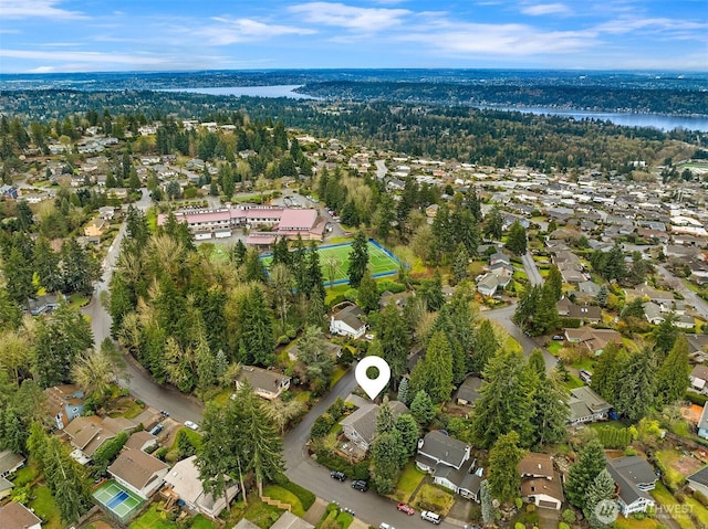 bird's eye view featuring a residential view and a water view